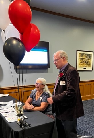 Pattie Espinosa and Dan Jones work the registration table.